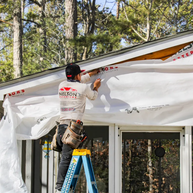 Moisture barrier being installed by Nelson Exteriors