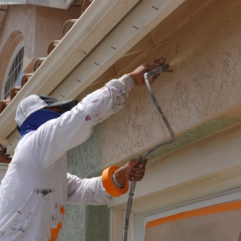 a person painting a building