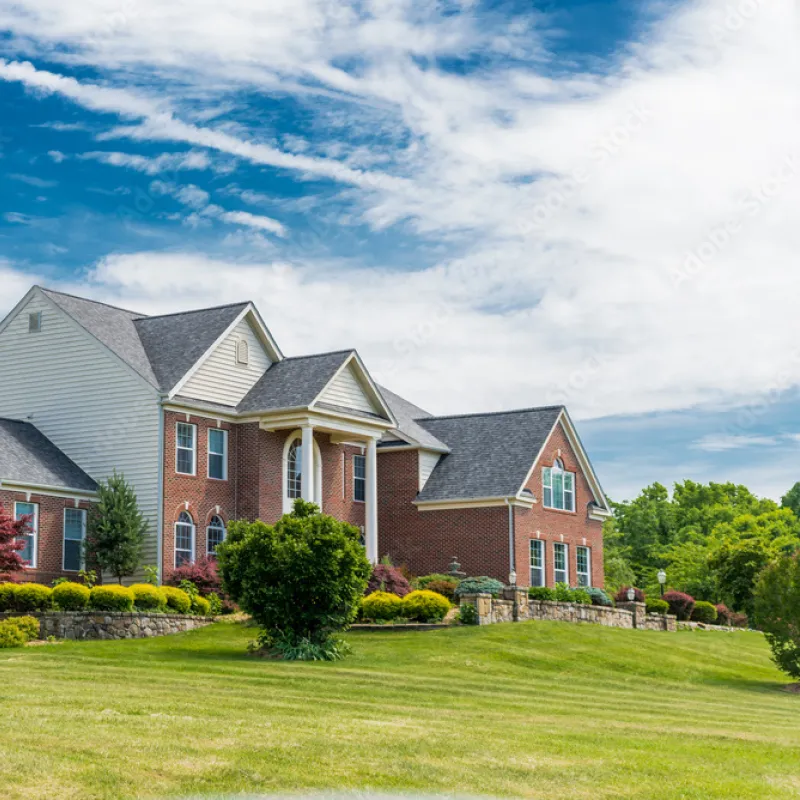 a large house with a lawn in front of it