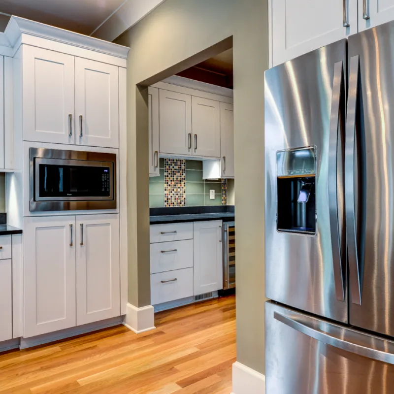 a kitchen with white cabinets