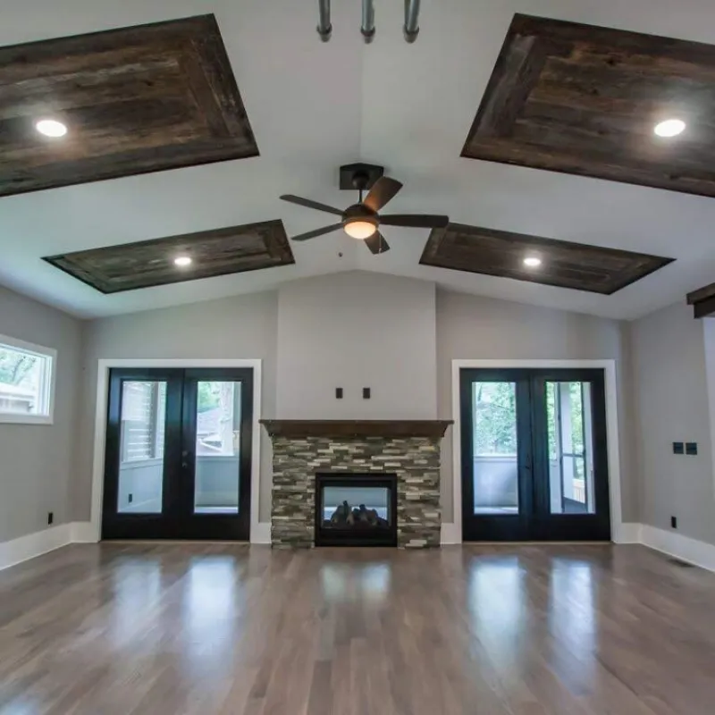 a room with a fireplace and a wood floor