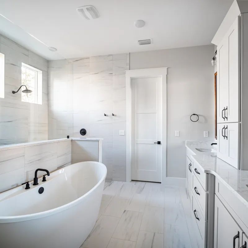 a bathroom with a tub and sink