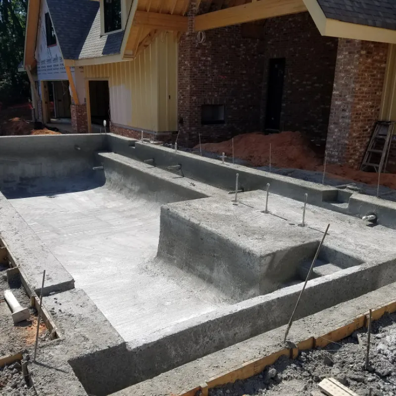 a concrete foundation in front of a building