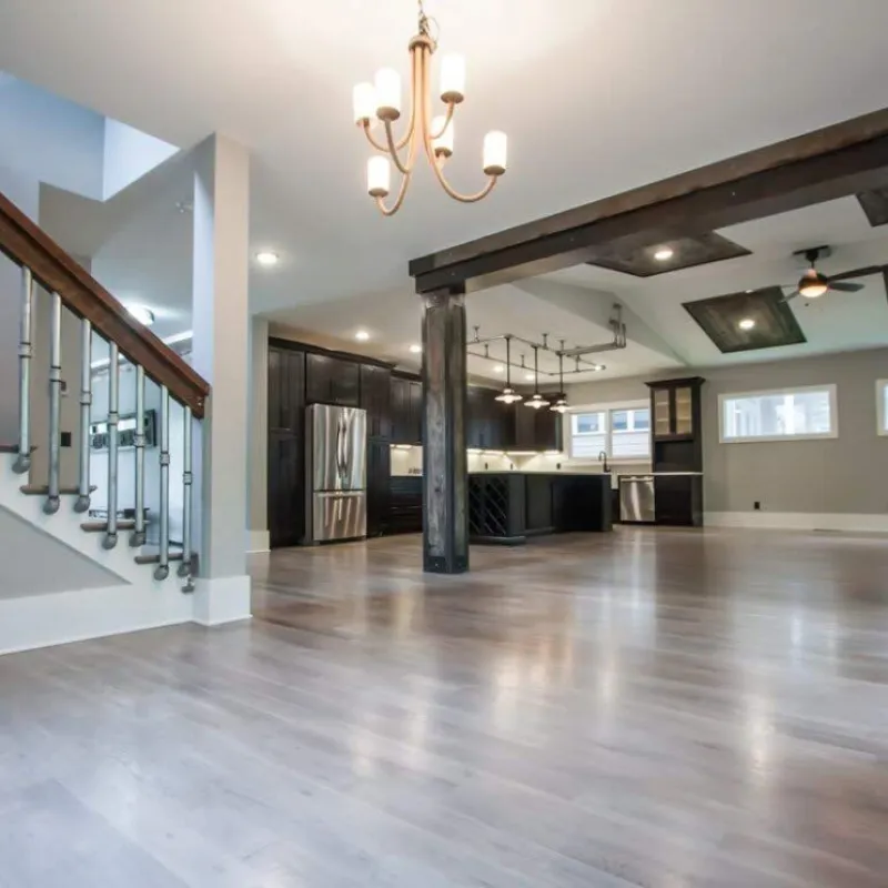a large room with a wood floor and white walls
