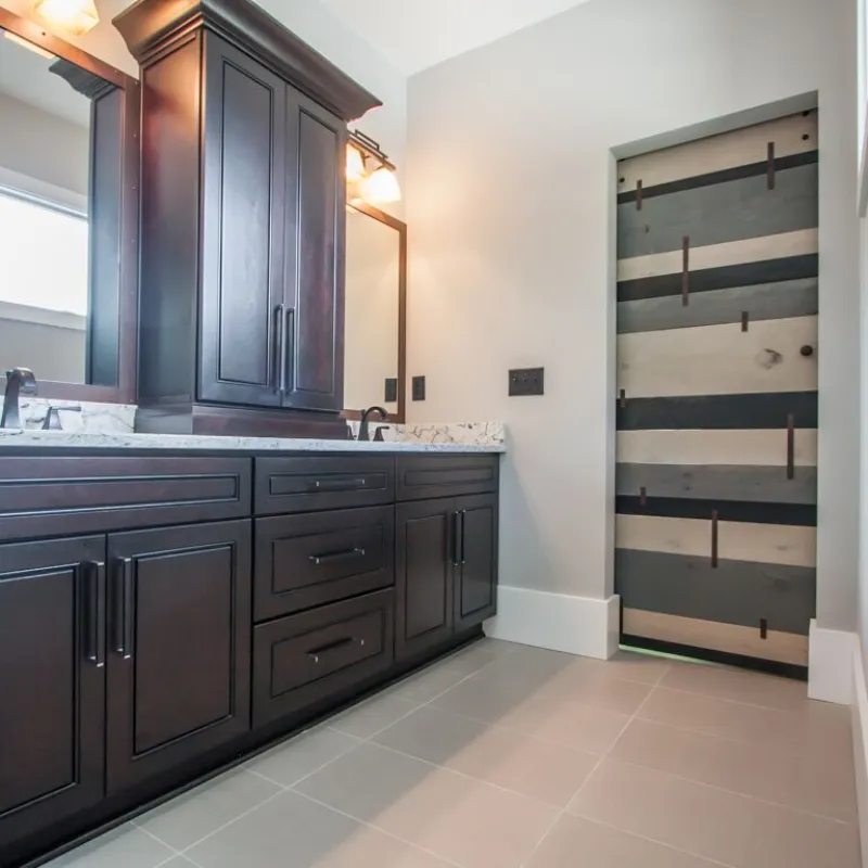 a kitchen with black cabinets