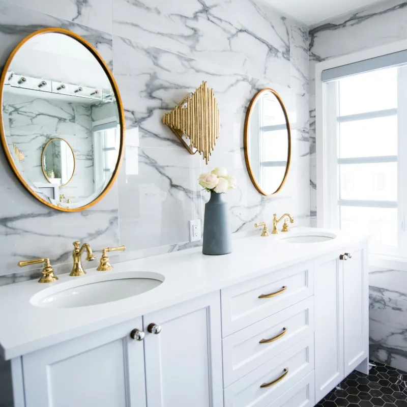 a bathroom with a mirror and sink