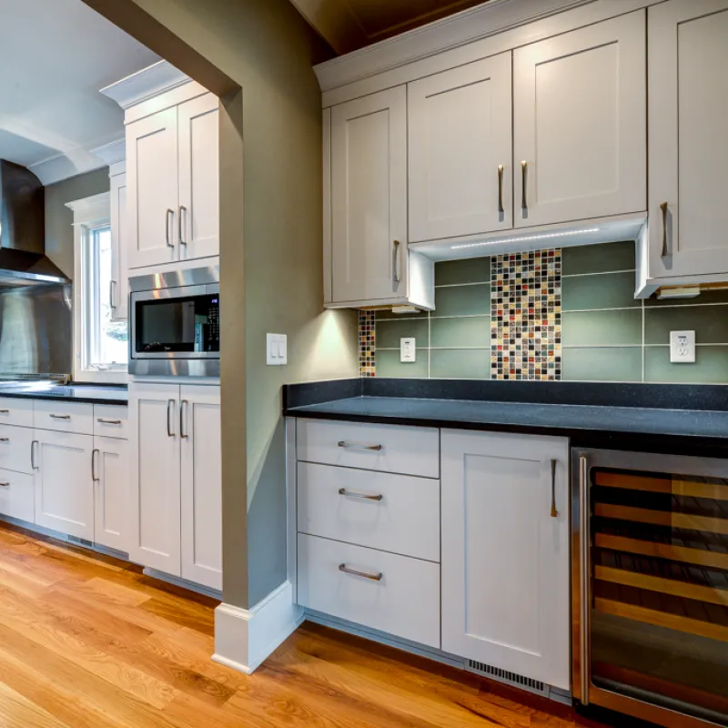 a kitchen with white cabinets