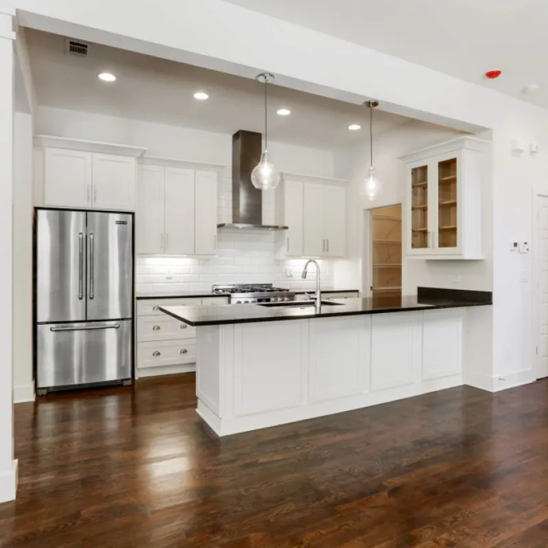 a kitchen with white cabinets