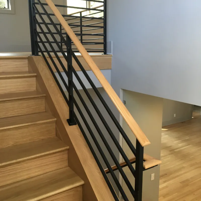 a staircase with wood railings