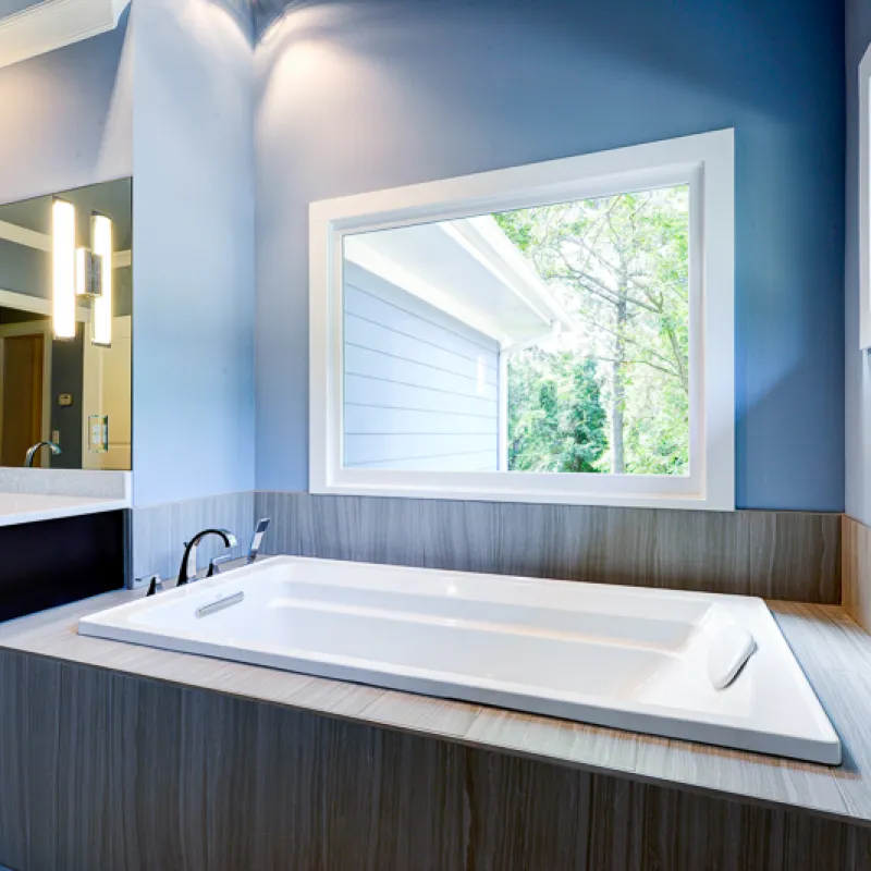 a bathroom with a tub and sink