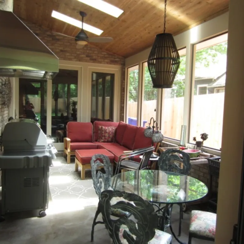 a living room with a red couch