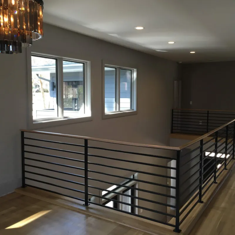 a room with a staircase and windows