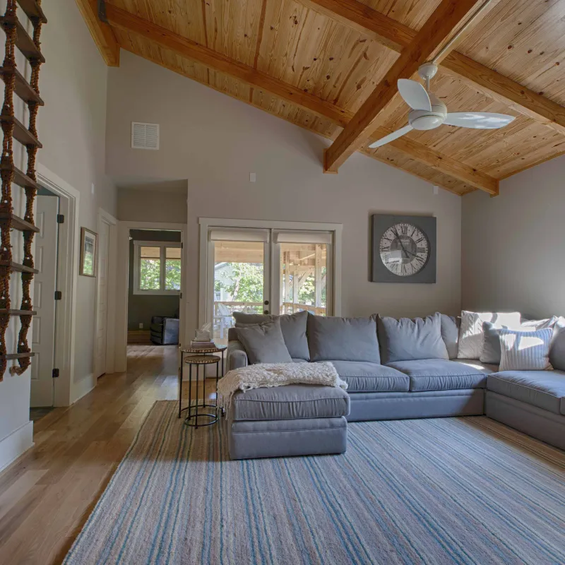 a living room with a wood ceiling