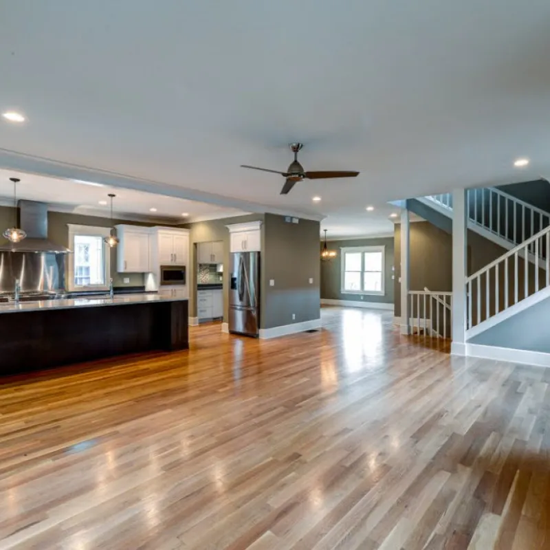 a large room with a wood floor and a wood floor
