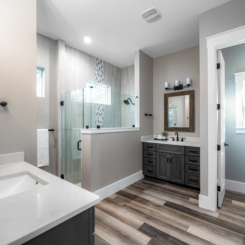 a bathroom with a tub sink and a shower