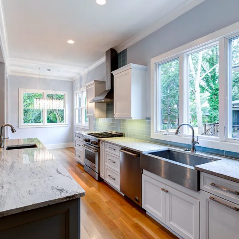 a kitchen with marble counters