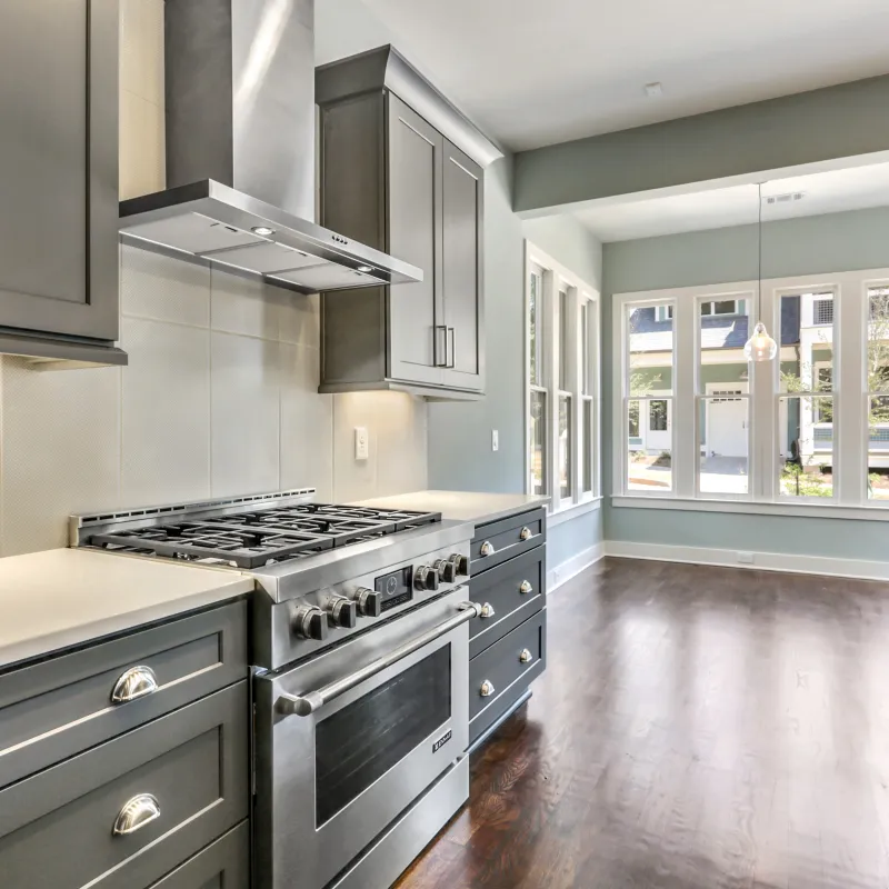 a kitchen with black appliances