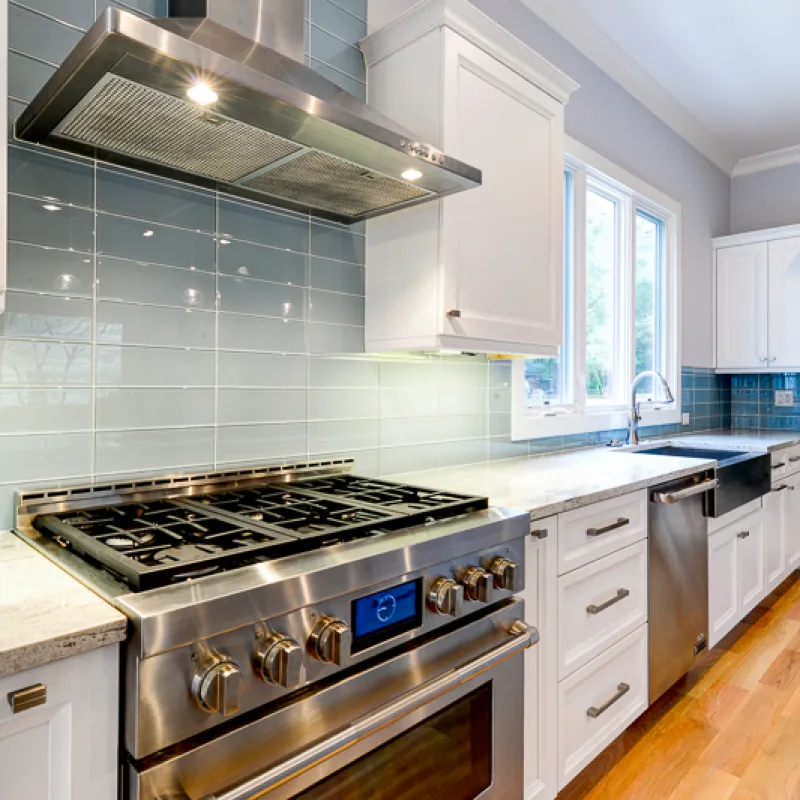 a kitchen with white cabinets