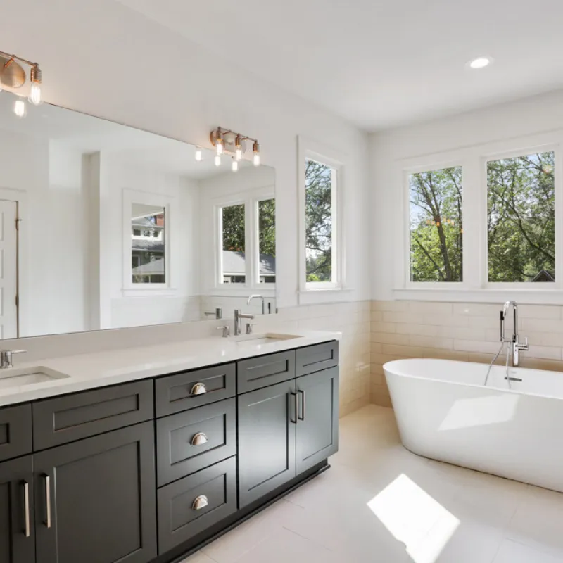 a bathroom with a tub and sink