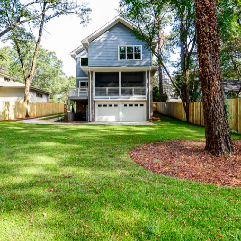 a house with a yard and trees