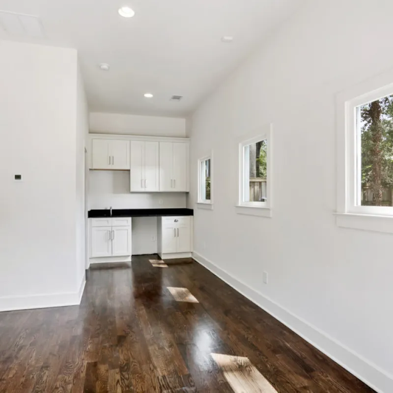 a room with white walls and a wood floor