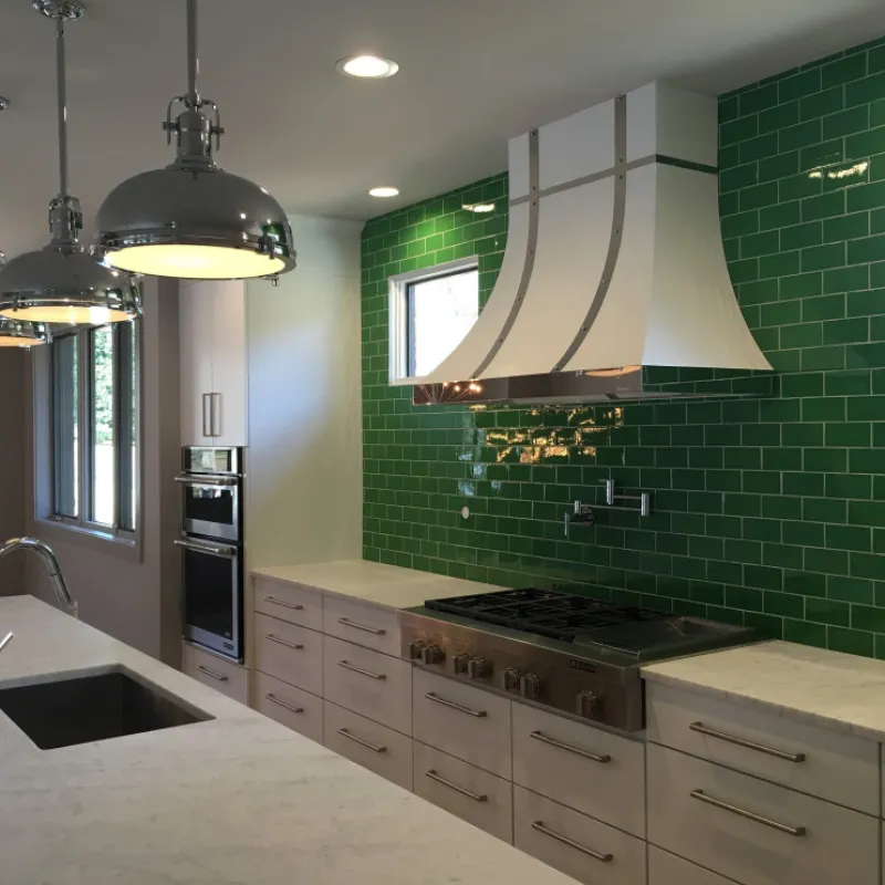 a kitchen with green walls