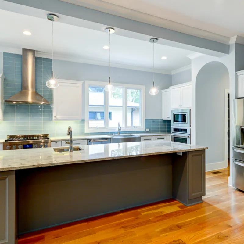 a kitchen with white cabinets