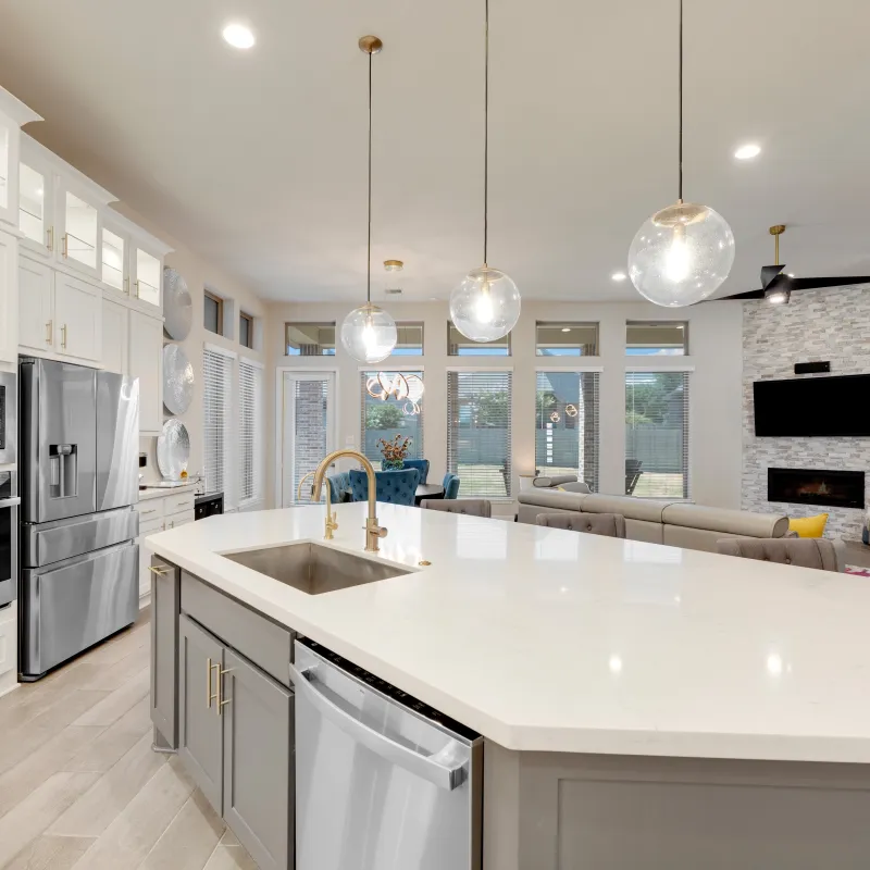 a kitchen with white cabinets