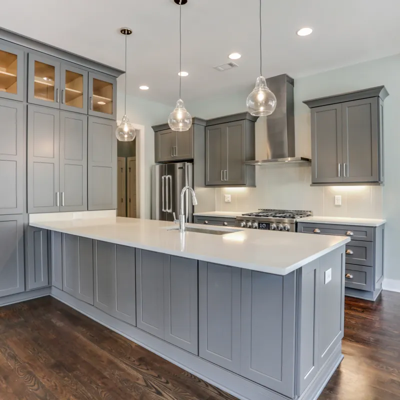 a kitchen with white cabinets