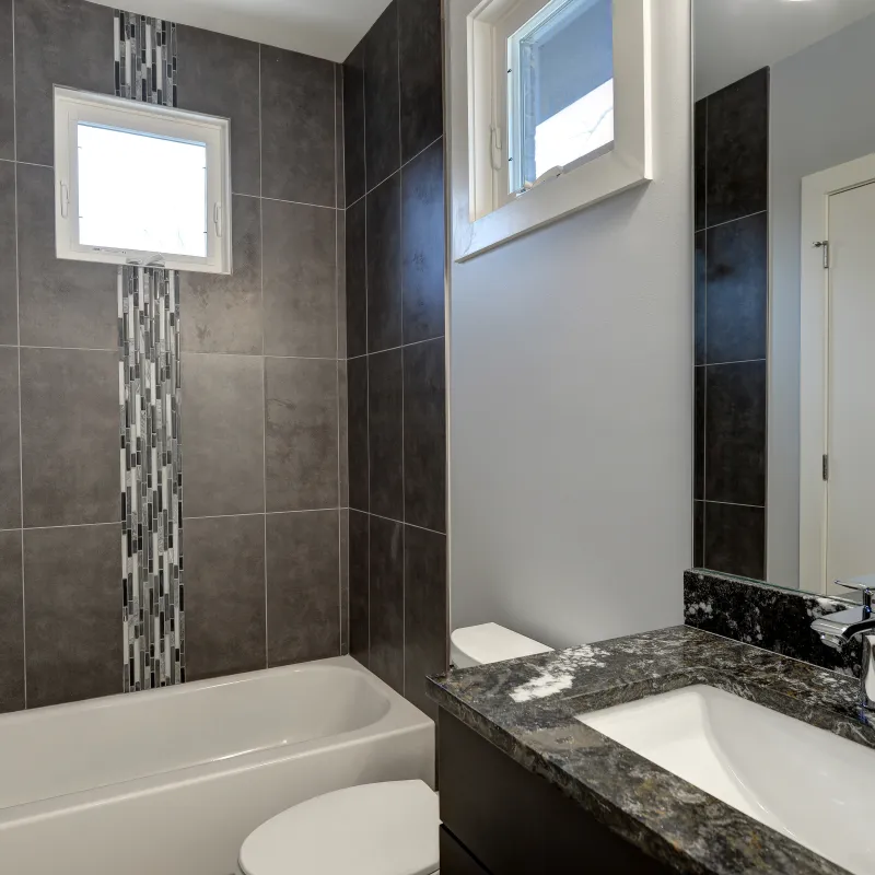 a bathroom with a tub sink and a mirror