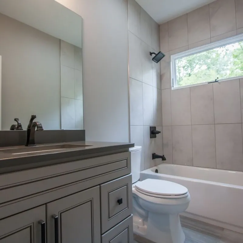 a bathroom with a tub sink and toilet