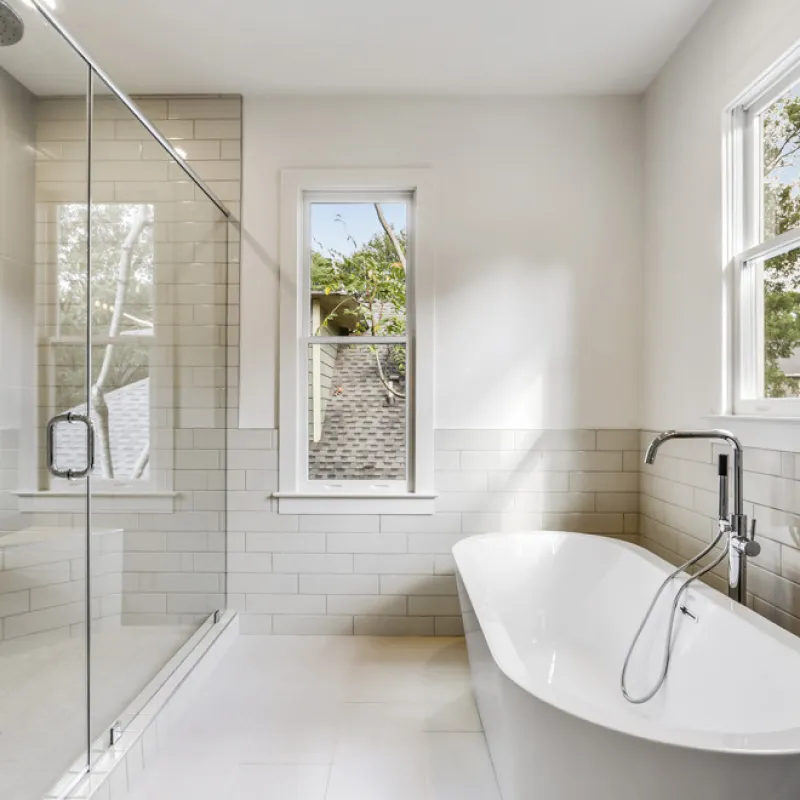 a bathroom with a tub and a sink