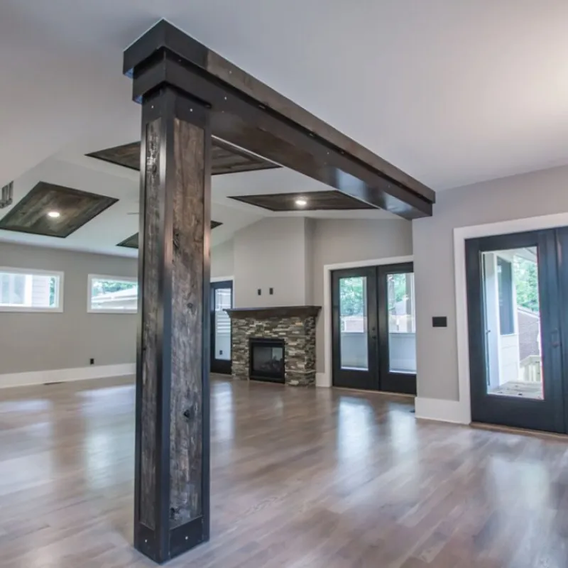 a room with a fireplace and wood floors