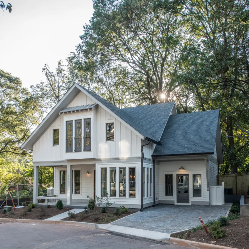 a white house with a black roof