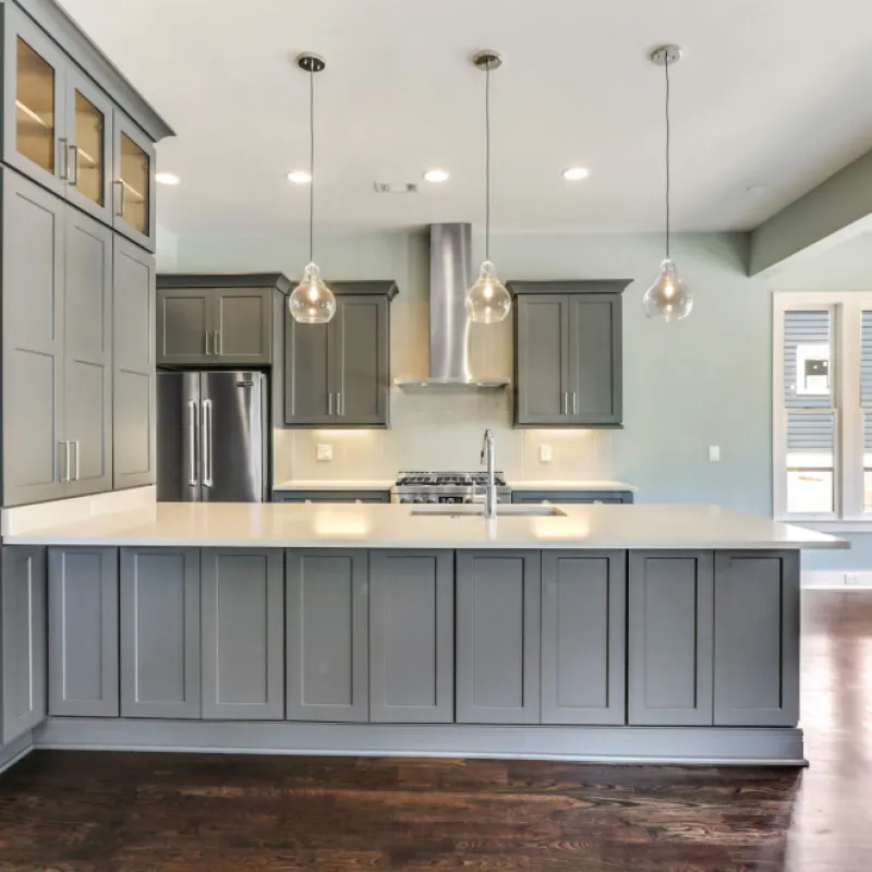 a kitchen with white cabinets