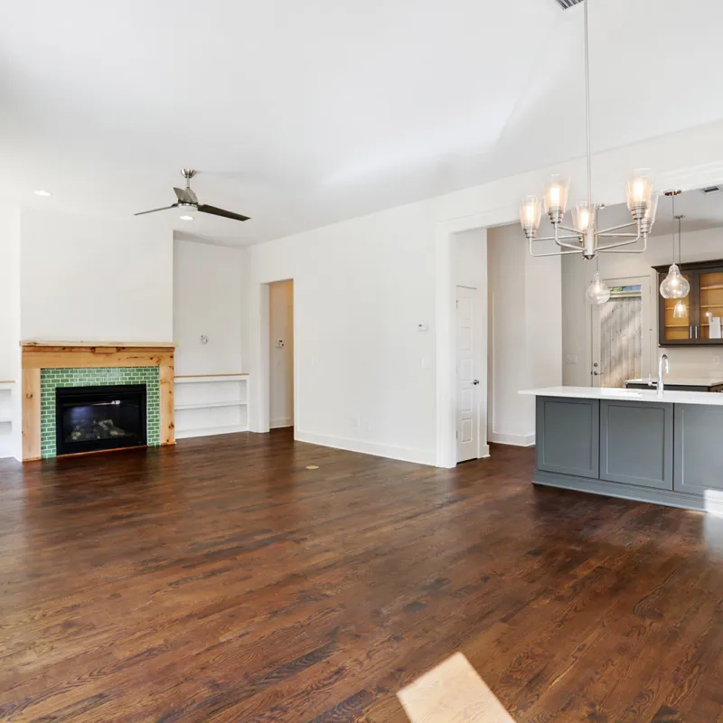 a large kitchen with a fireplace