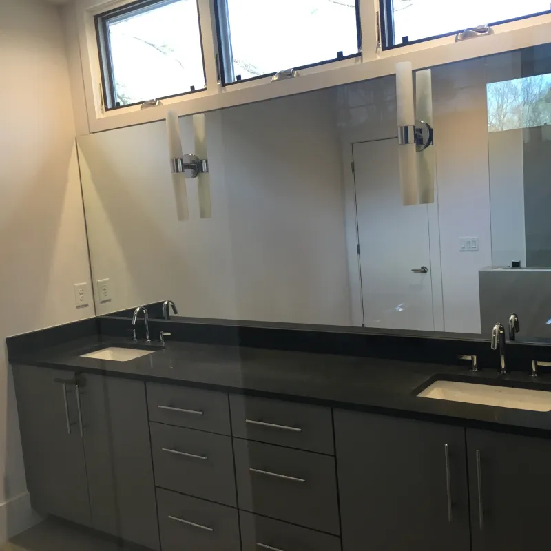 a bathroom with a large mirror