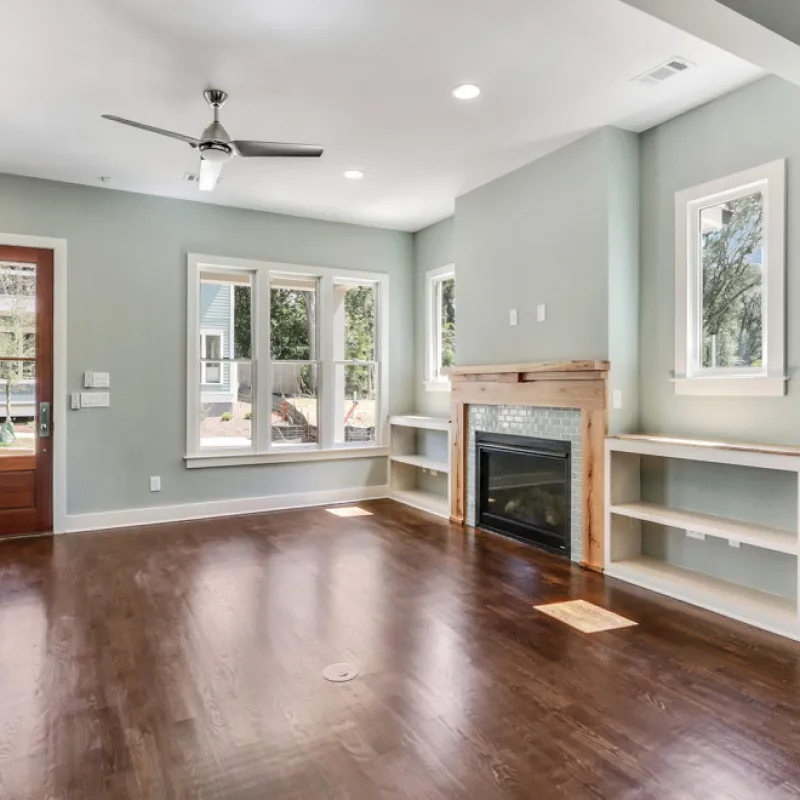 a large living room with a fireplace