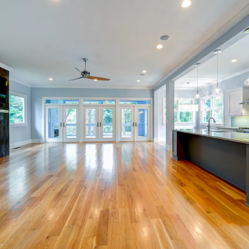 a large kitchen with a wood floor