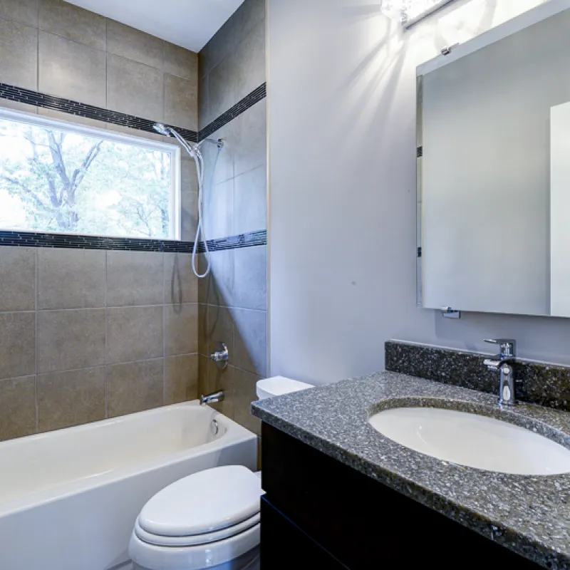 a bathroom with a tub sink and toilet
