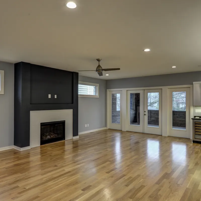 a large living room with a fireplace