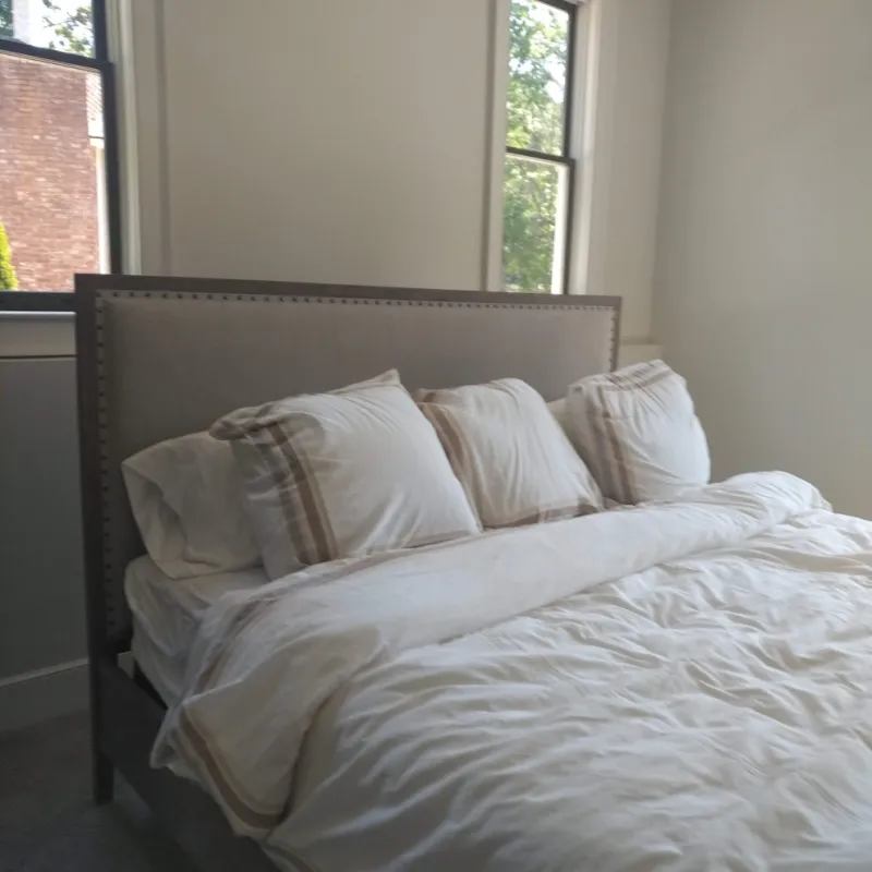 a bed with white pillows