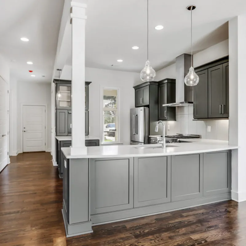 a kitchen with white cabinets