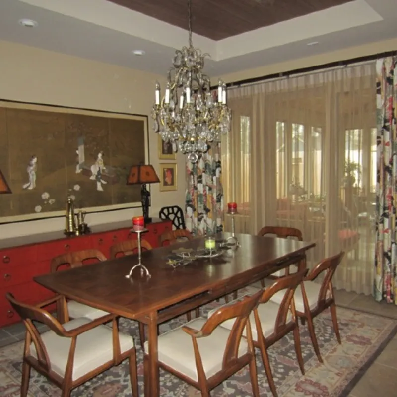 a dining room with a chandelier and a table