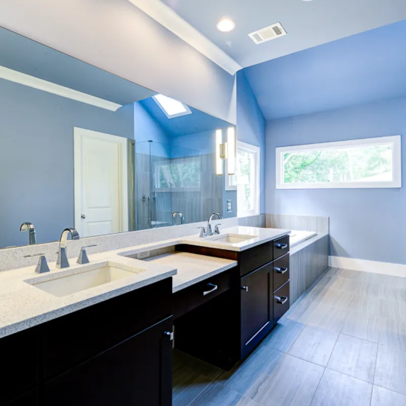 a bathroom with sinks and mirrors