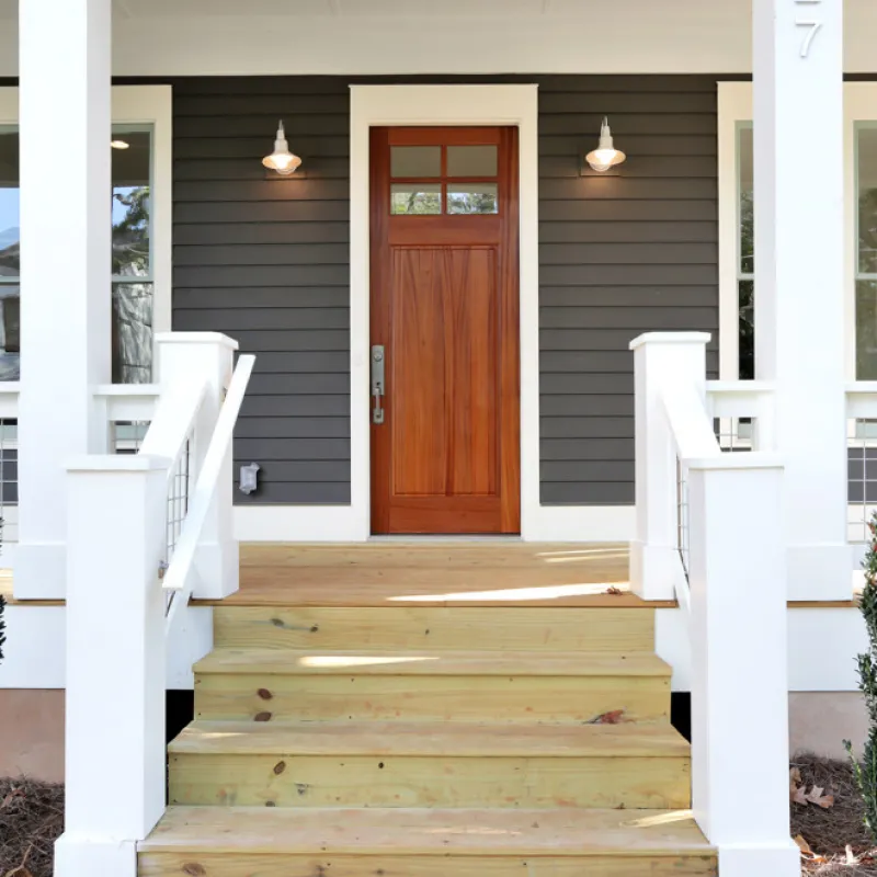 a wooden staircase leading to a door