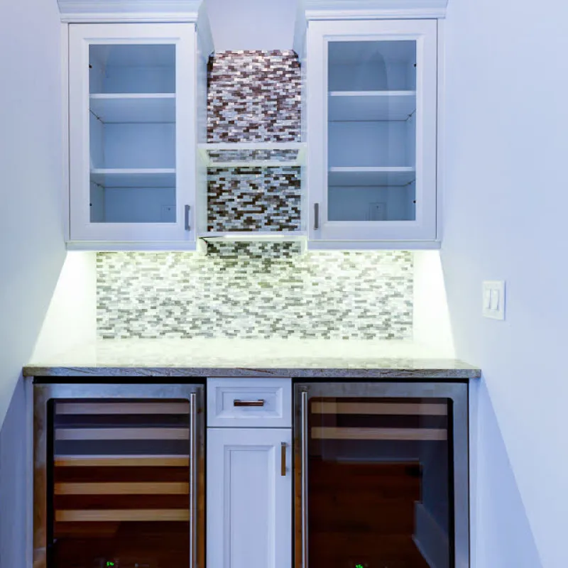 a kitchen with white cabinets