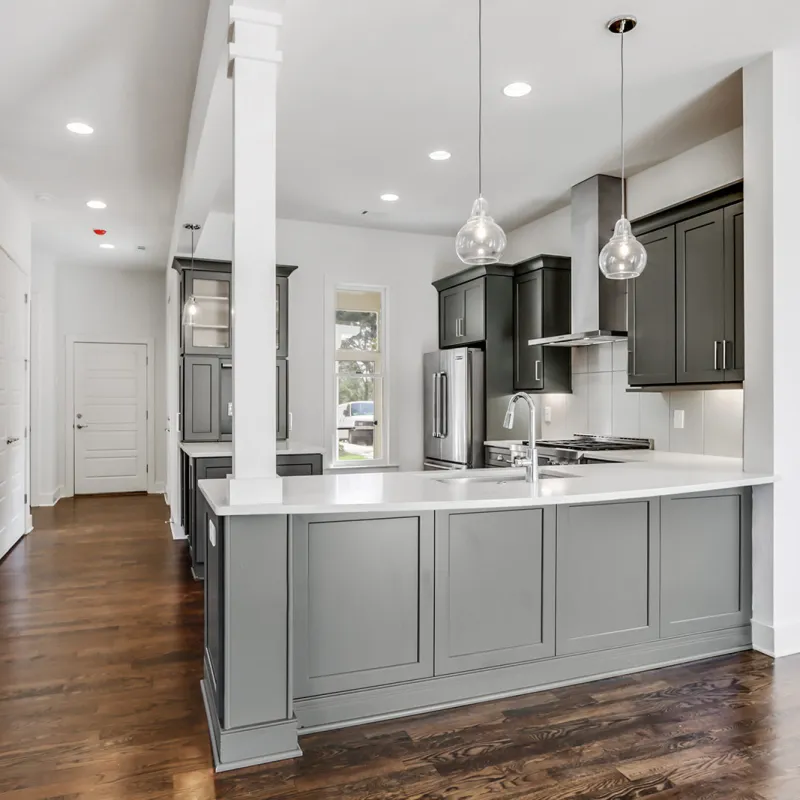a kitchen with white cabinets