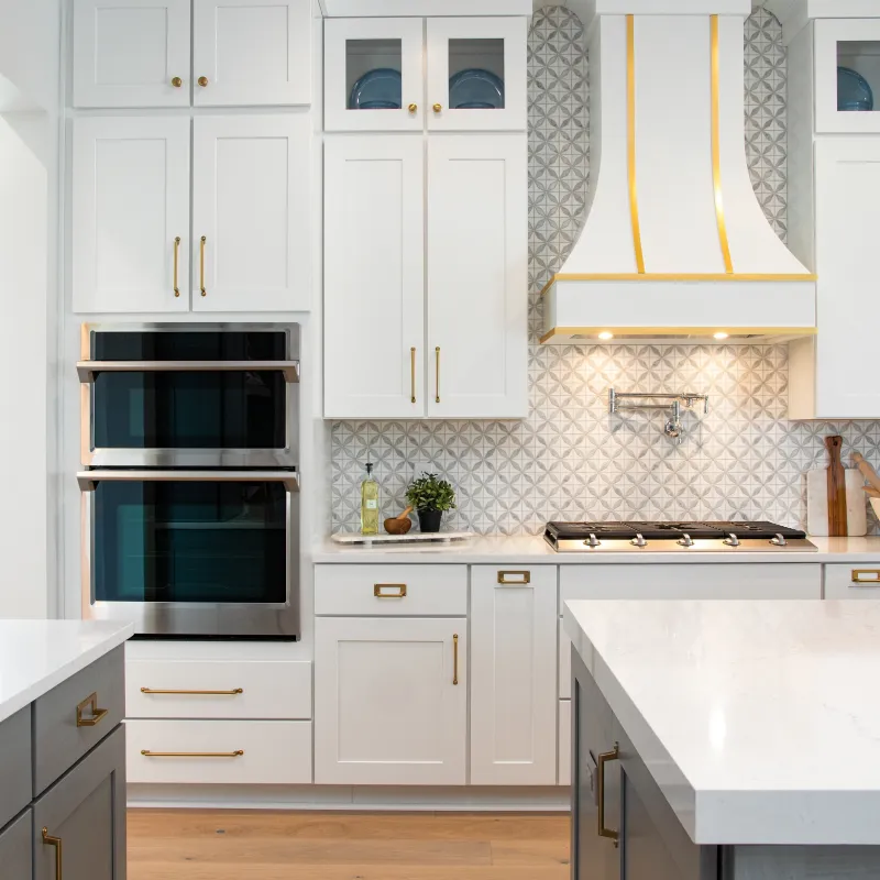 a kitchen with white cabinets
