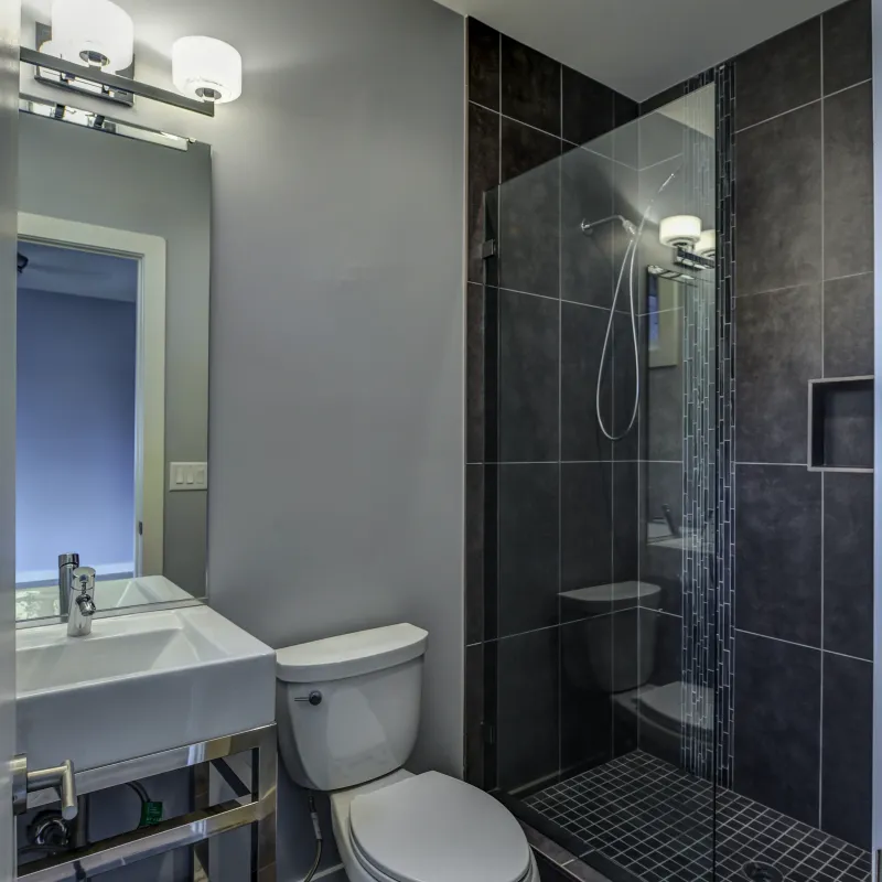 a bathroom with a shower and sink